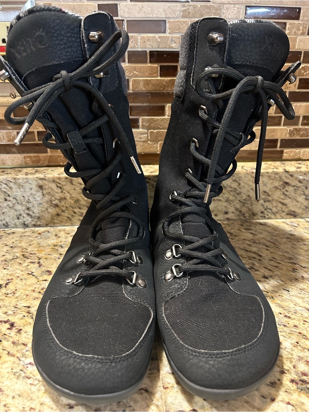 XERO “MIKA” women’s tall lace up water resistant boots. Size 9. Flannel lined